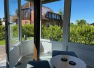 Wintergarten mit Gartenblick