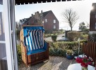 Terrasse mit Teilmeerblick und Strandkorb